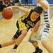 Chelsea's Jacob Fischhaber attempts to move the ball around Skyline's Peter Bakker during the first half at Skyline on Tuesday night.  Melanie Maxwell I AnnArbor.com